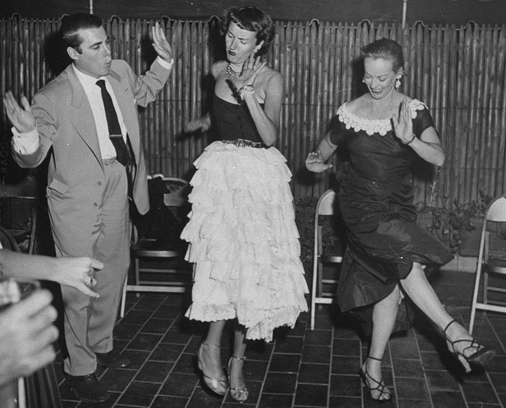#16 Faye Emerson with Pete Brandon and actress Sally Kirkland in the Charleston at party on E. 73rd St, 1950.