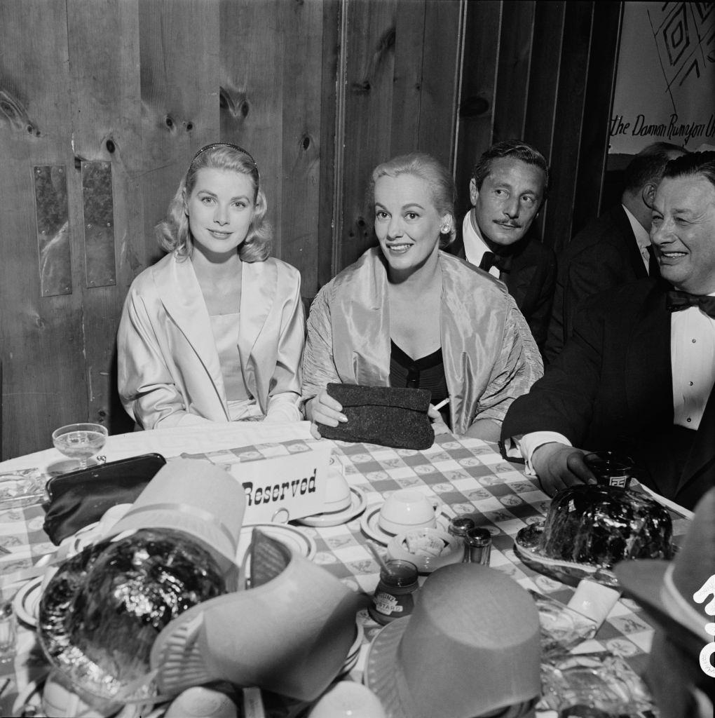 #18 Faye Emerson with Grace Kelly, Oleg Cassini and restauranteur Bernard ‘Toots’ Shor at a party for the Damon Runyon Theater, 1955.