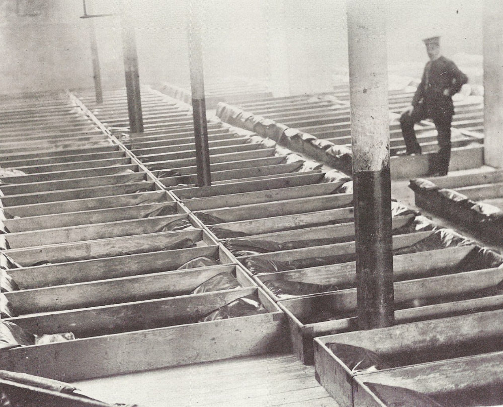 #4 These rows of “coffins” were the men’s sleeping quarters in London’s Burne Street hostel, 1900.