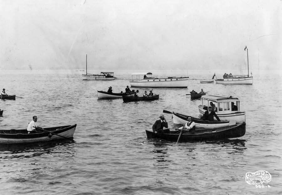 #10 Spectators in small boats crowd the water around the Komagata Maru.