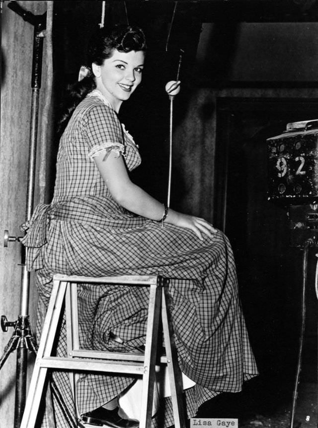 #21 Lisa Gaye sitting on the stool.