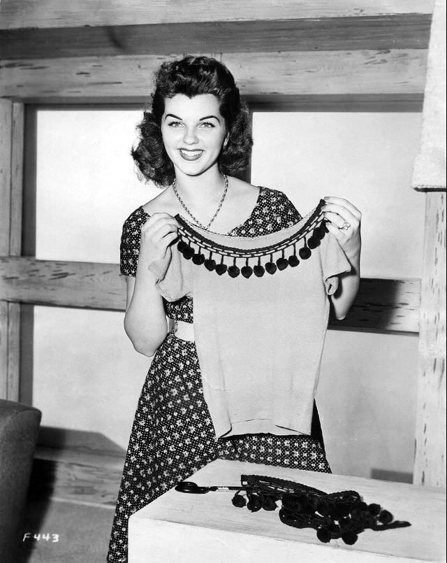 #9 Lisa Gaye showing her dress, 1950s.