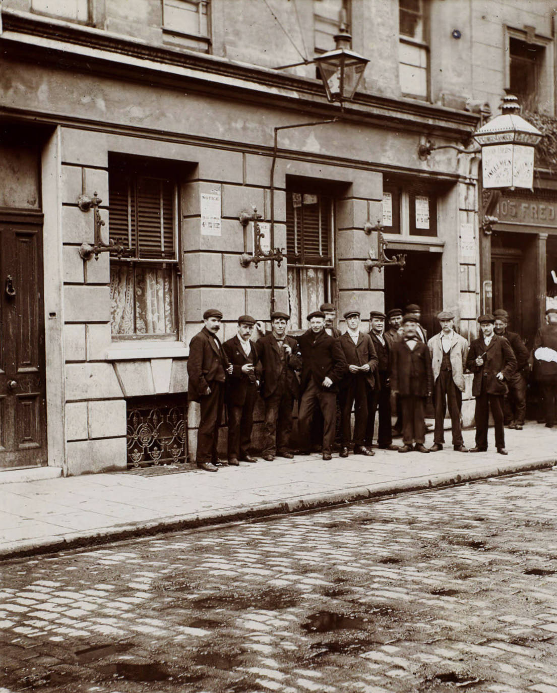 #19 Two relay system lodging, lodgers who have been on night work waiting till the beds of a doss house are vacated by men employed during the way.