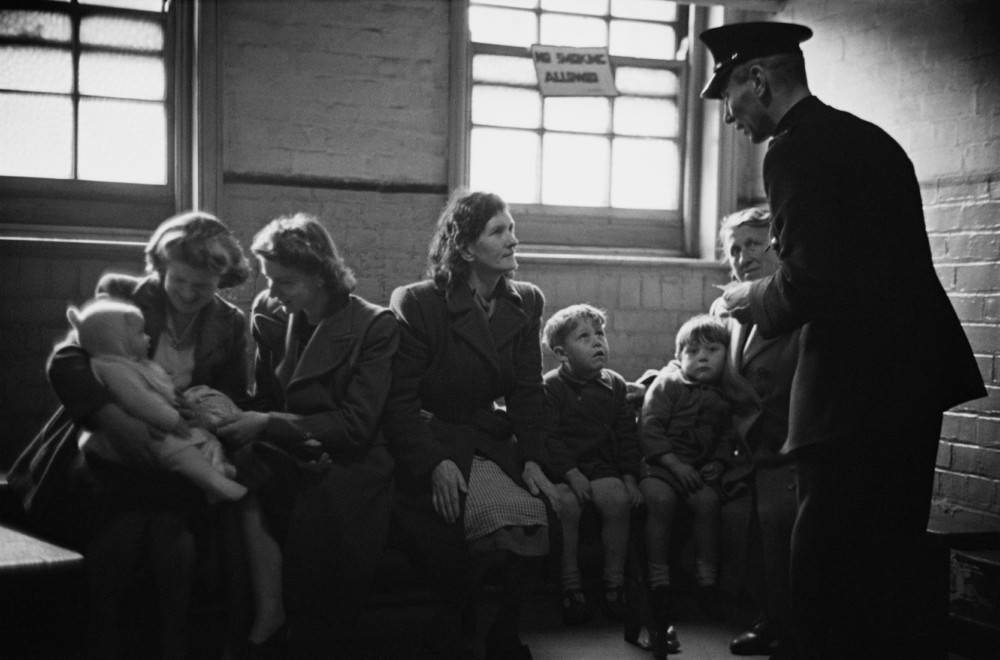 #11 Prison officer Davidson talks to a group of visitors at Strangeways Prison.