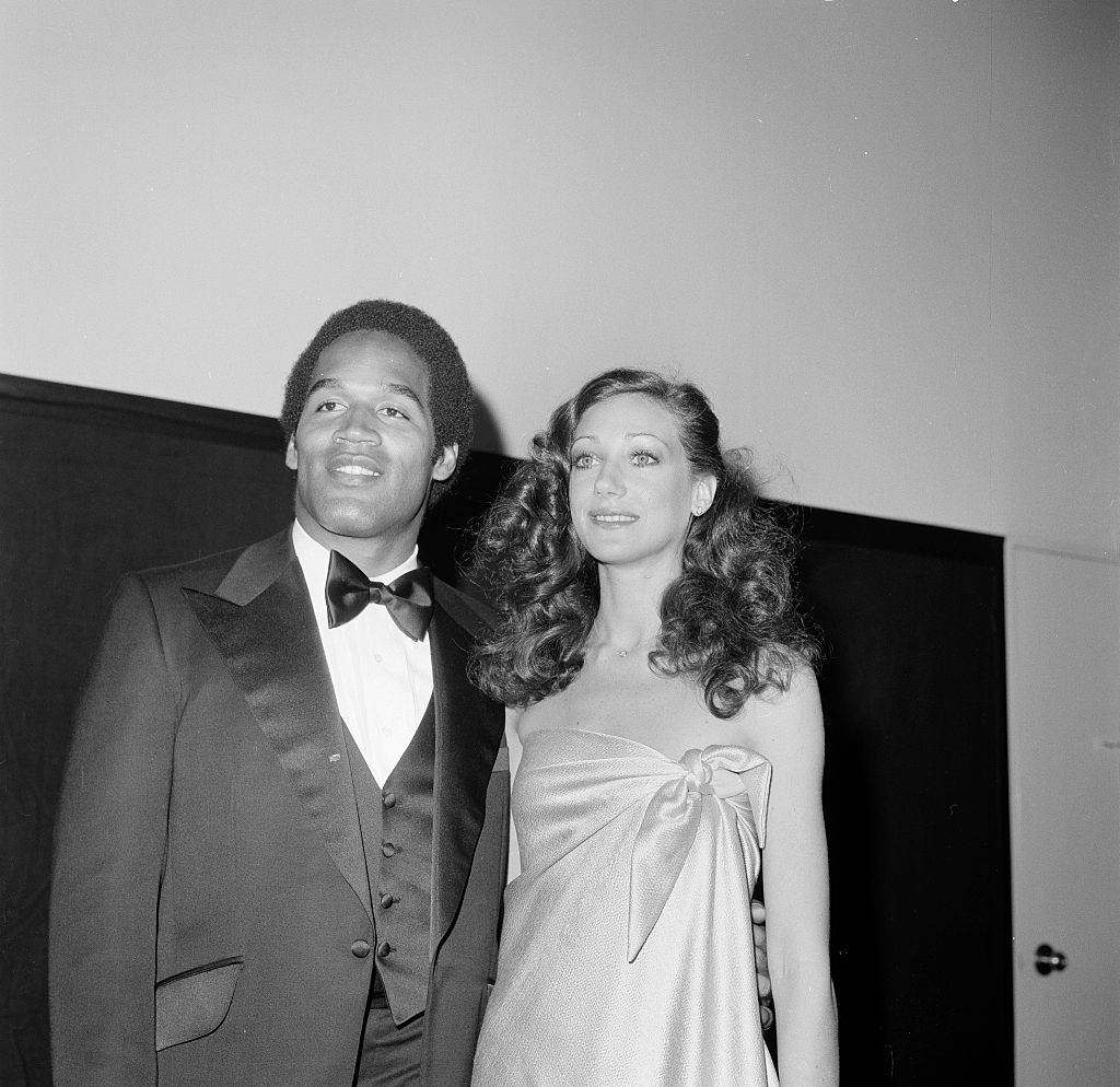 #14 Marisa Berenson with football player O. J. Simpson, 1970.