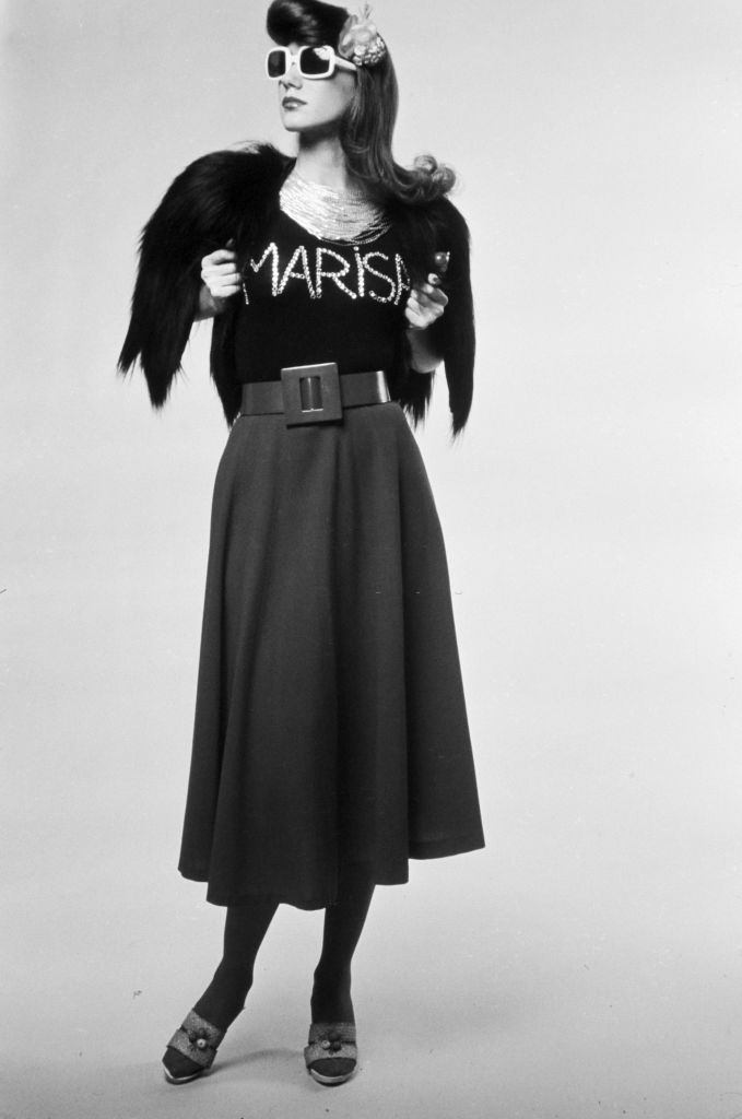 #23 Marisa Berenson poses with some attributes of “kitsch” fashion, 1970s.