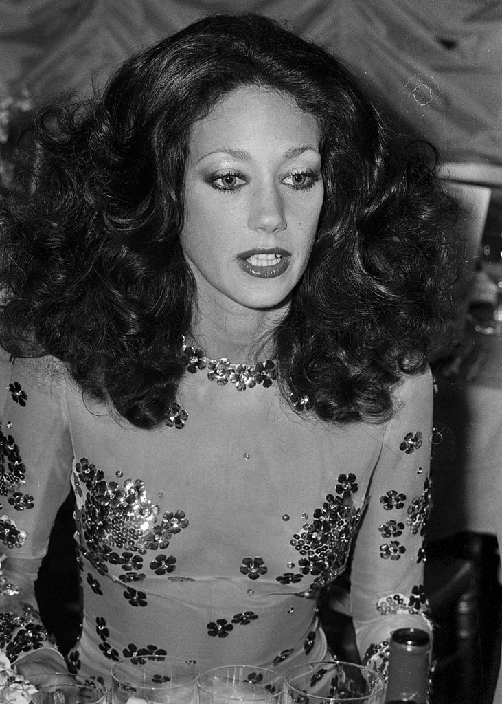 #33 Marisa Berenson in silver flower dress, 1972.