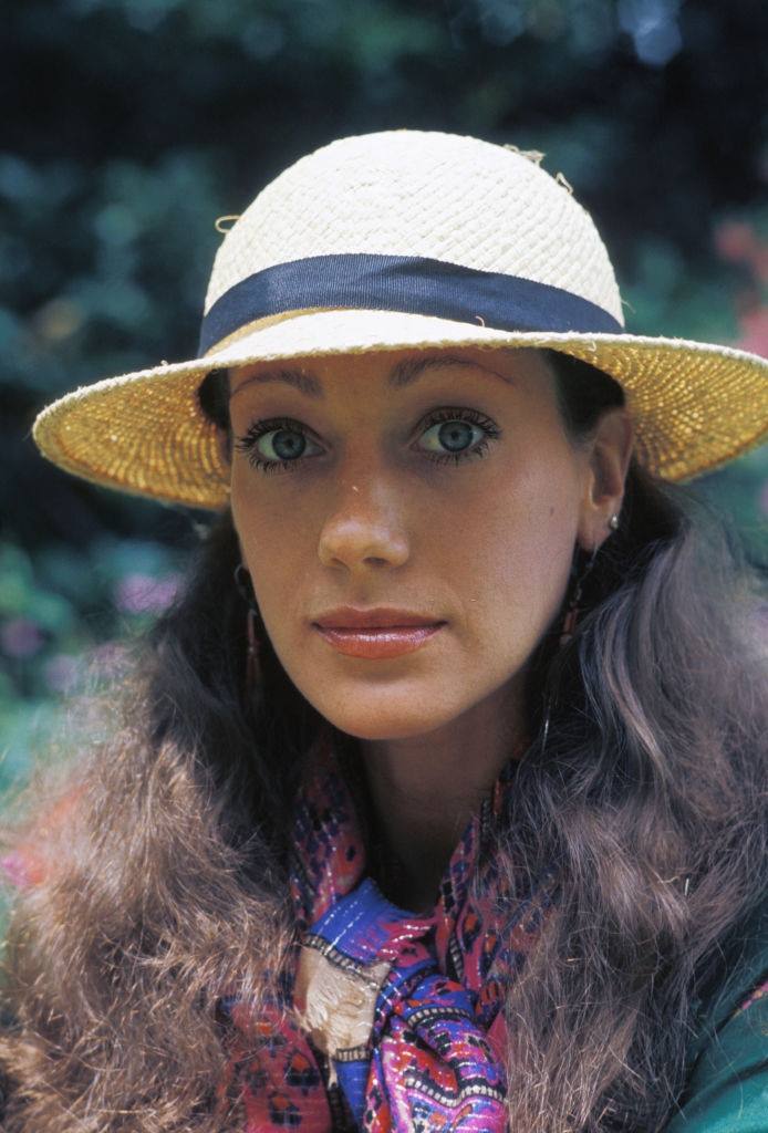 #54 Marisa Berenson wearing a hat, 1977.