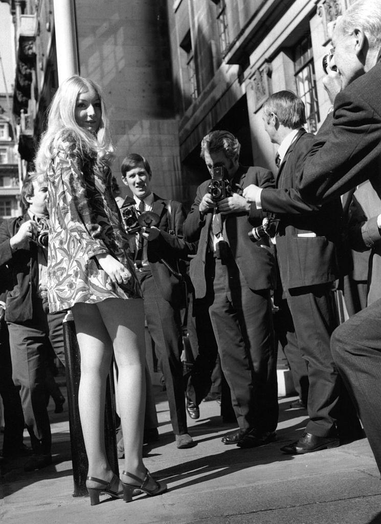 #38 Mary Hopkin poses for press photographers outside the BBC in London, 1969.