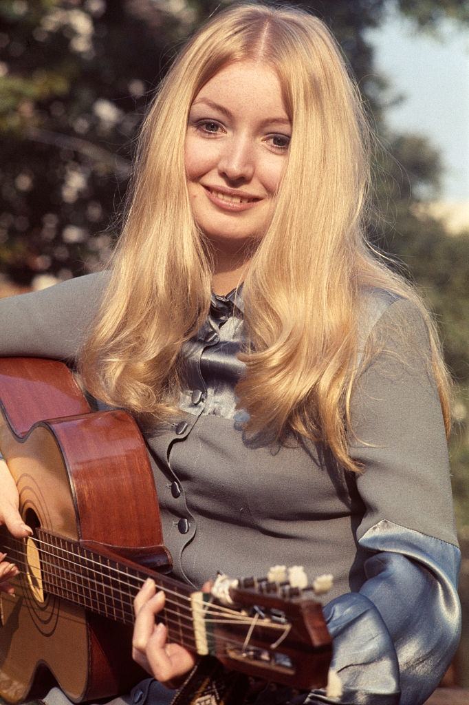 #40 Mary Hopkin posed holding an acoustic guitar in London in October 1969
