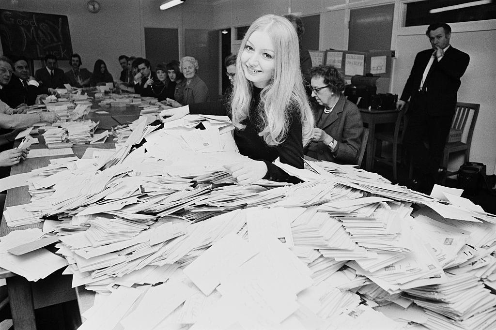 #51 Mary Hopkin sorting postcards at the BBC to decide which song she will sing in the upcoming Eurovision Song Contest, London, 1970.
