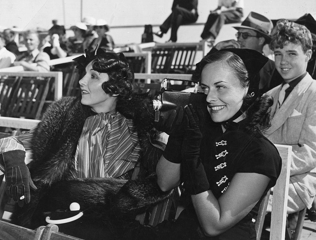 #31 Paulette Goddard with Burgess Meredith and Erich Remarque, 1935.