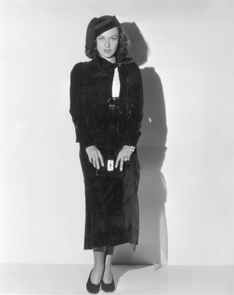 #22 Paulette Goddard posing in a black dress, 1935.