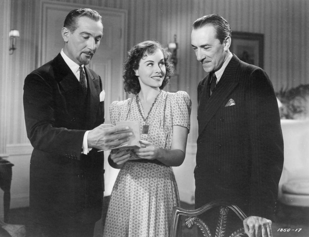 #58 Paulette Goddard with Paul Lukas and Pedro de Cordob in the movie ‘The Ghost Busters’, 1940.