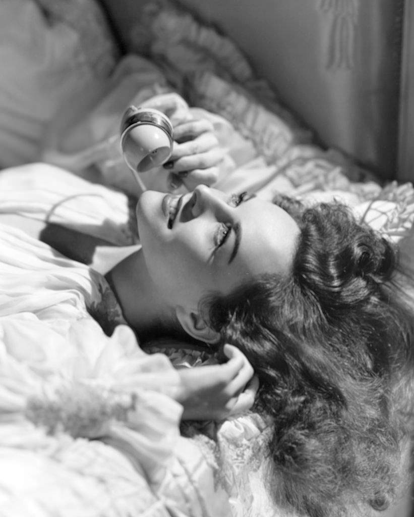 #62 Paulette Goddard on Bed with Telephone, 1940.