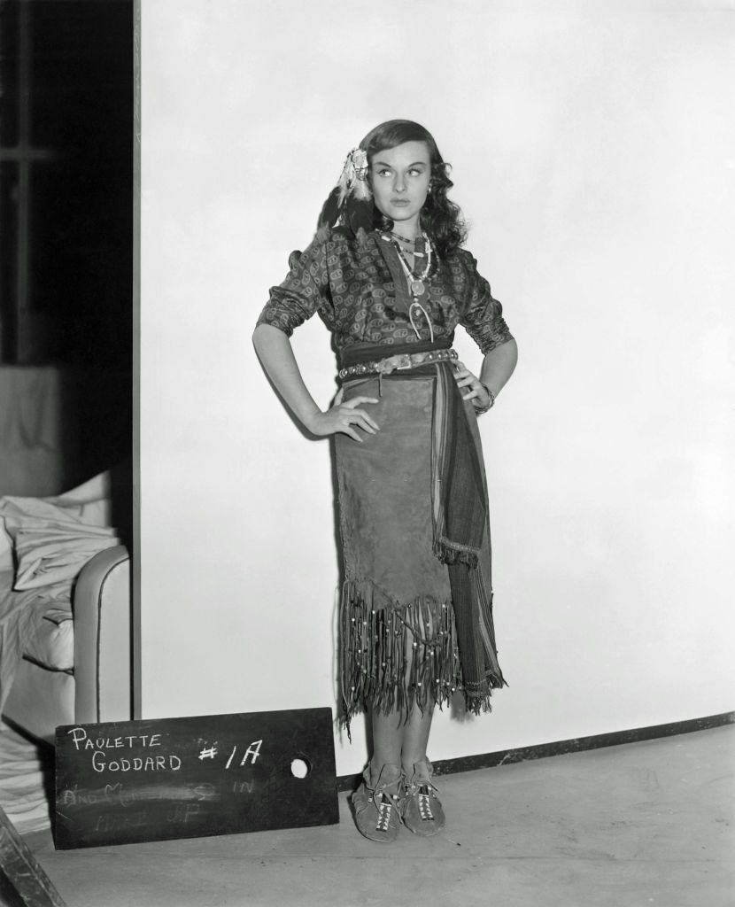 #70 Paulette Goddard in a scene from the movie “North West Mounted Police”, 1940.