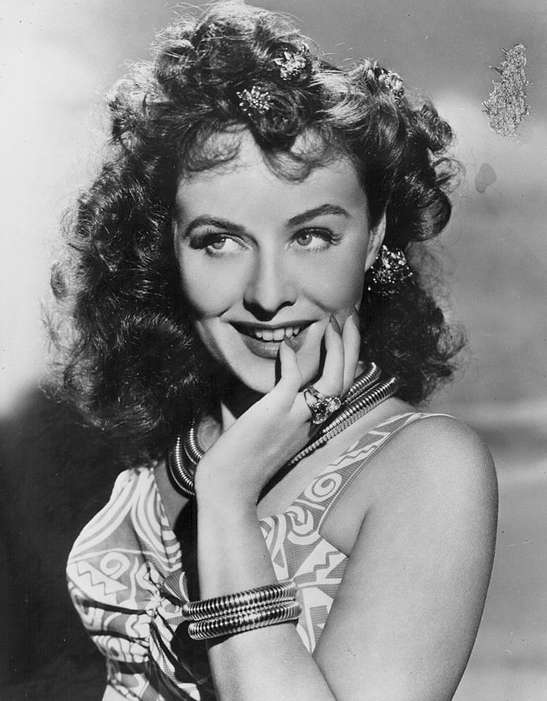 #48 Paulette Goddard, wearing a geometric print swimsuit, 1940.
