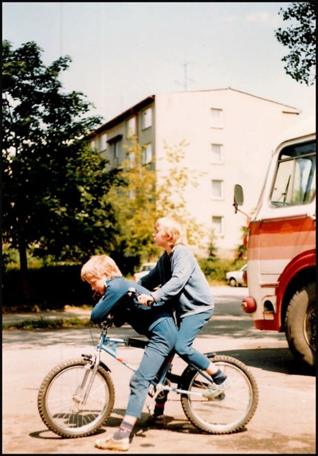 #50 The two children are playing by workers’ flats around the Moser glass factory in Karlovy Vary