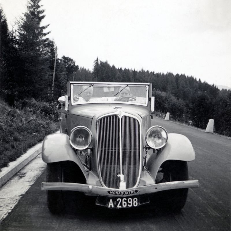 A Renault Monaquatre Cabriolet-Spider pictured on a country road on a bleak summer’s day.