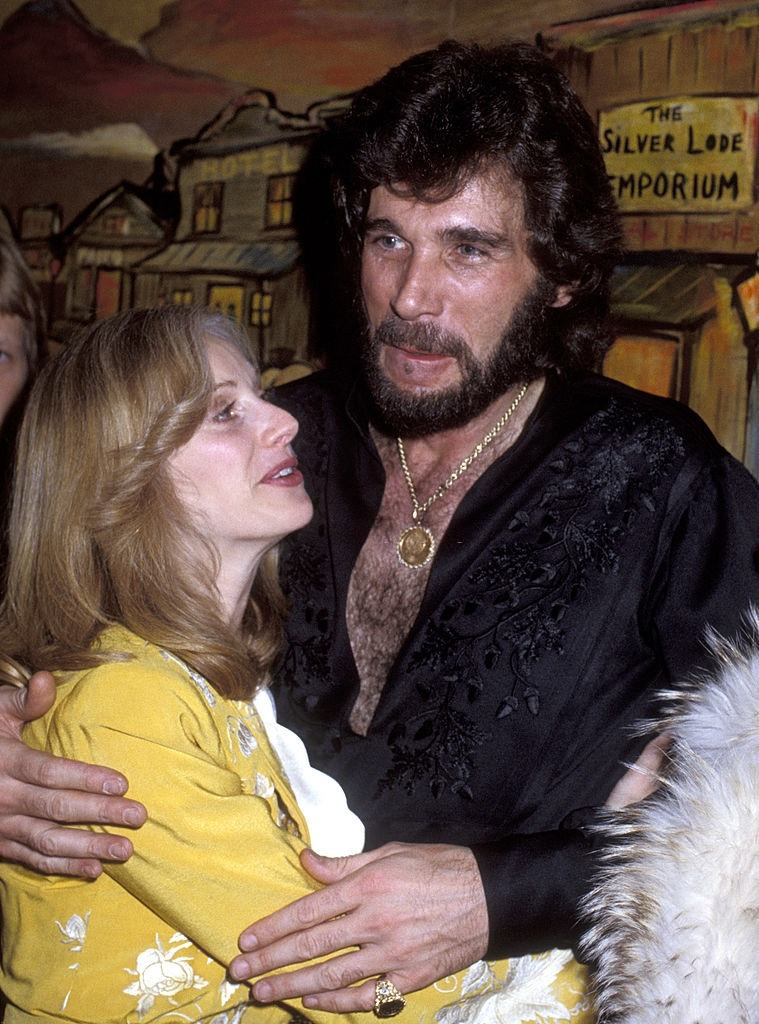 #22 Sondra Locke with musician Eddie Rabbitt attend Sondra Locke-Eddie Rabbitt Opening on February 1, 1979.