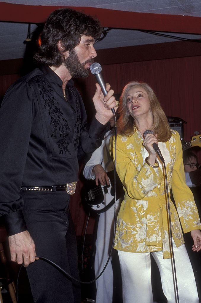 #23 Sondra Locke performing with musician Eddie Rabbitt, 1979.s