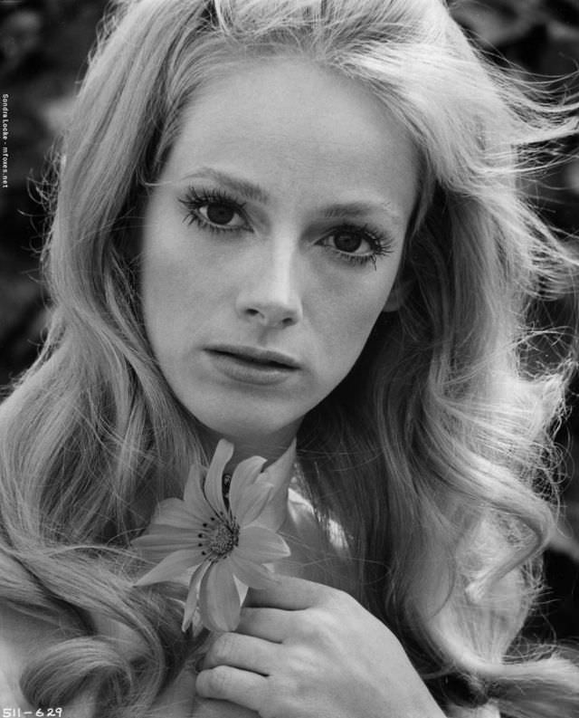 #57 Sondra Locke Posing with a flower, 1970.