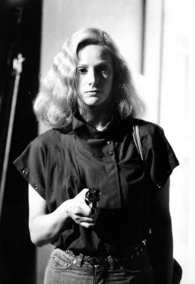 #4 Sondra Locke with a gun from a movie scene, 1960s.