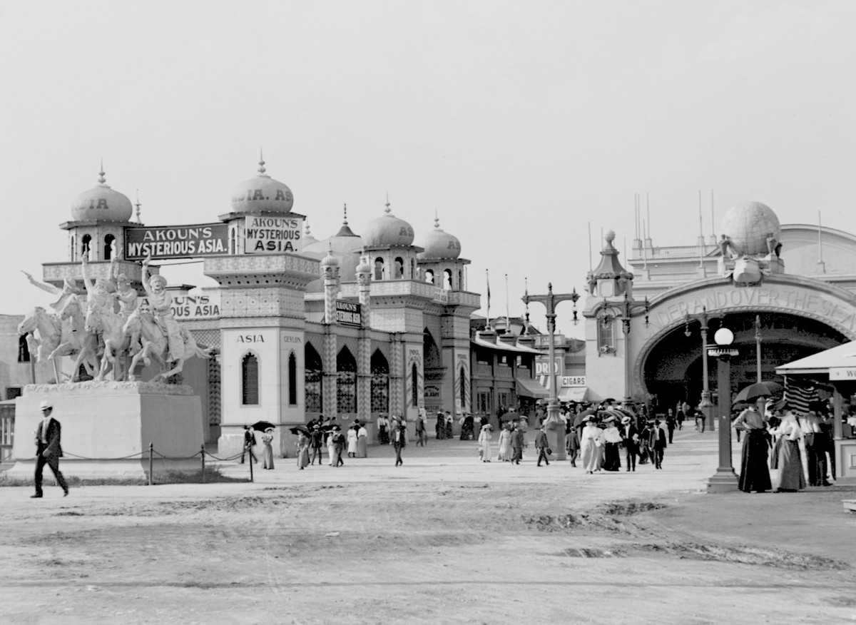 #70 The east entrance of the Pike with the statue Cowboys Shooting Up a Western Town, by Frederic Remington,
