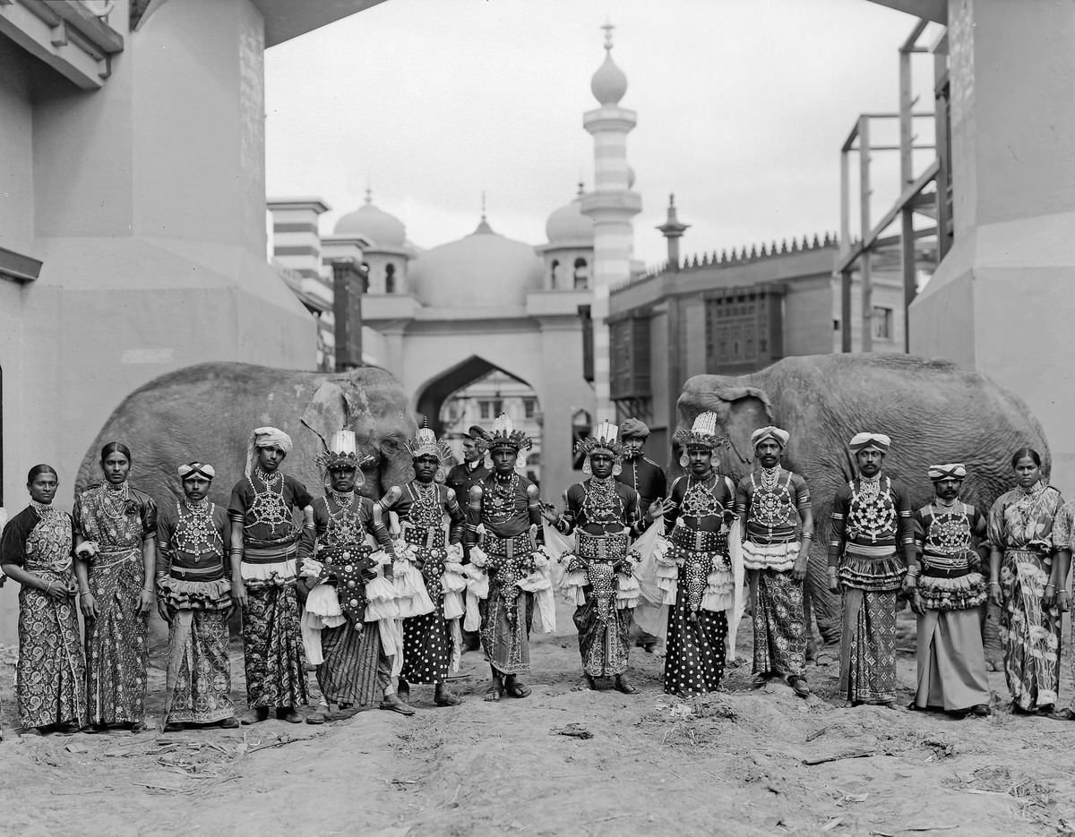 #37 Sinhalese dancers from the Mysterious Asia concession pose with elephants on the Pike.