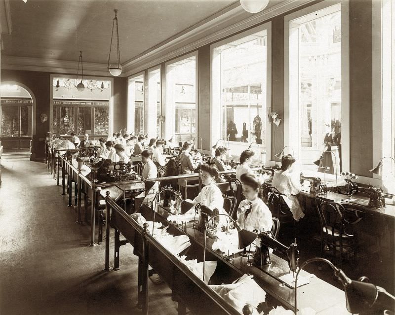 #60 Operators making corsets as part of the Singer Sewing Machine exhibit in the Palace of Manufactures at the 1904 World’s Fair, 1904