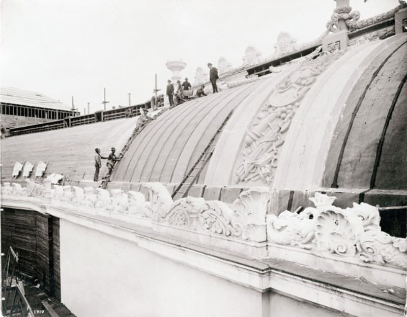 #67 Workers preparing the roof of the Palace of Liberal Arts for placement of staff during construction for the 1904 World’s Fair, 1904