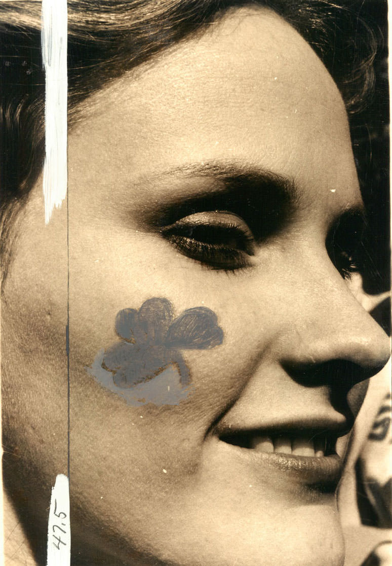 #10 Debbie Cook with a shamrock on her cheek at Hopkins Plaza. 1979.