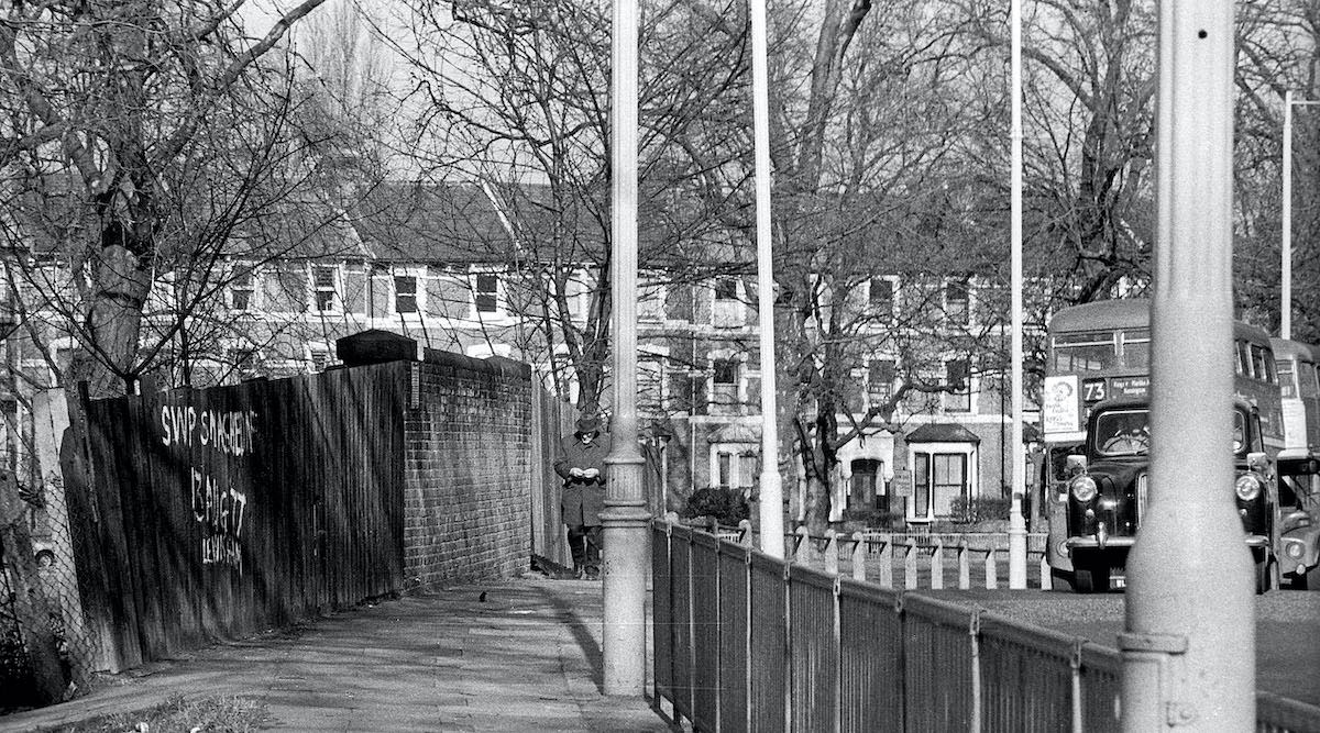 #38 Stoke Newington Common 1978 The graffiti on the fence referred to the 13th August 1977 – the Battle of Lewisham