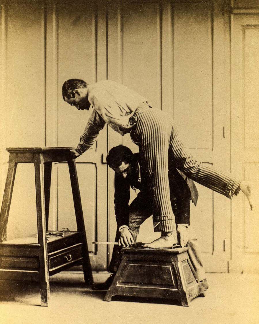 #8 Bertillon measures a subject’s foot.