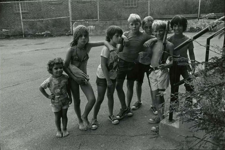 #11 Seven children standing in the courtyard of the Jefferson Park Housing Project, Jefferson Park, 1974