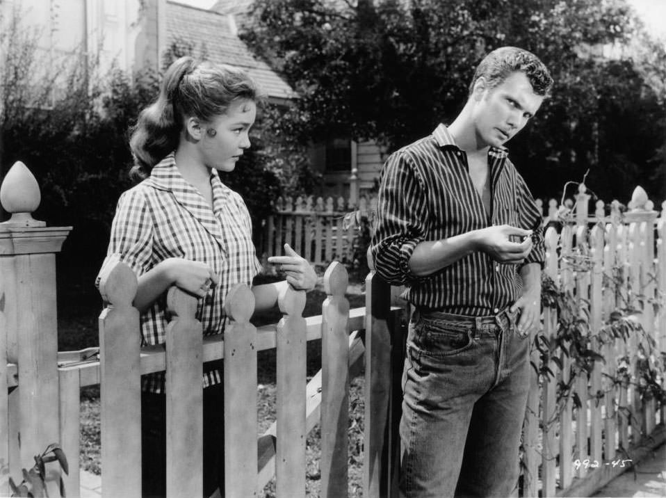 #43 Tuesday Weld looks to a man in a scene from the film ‘Because They’re Young’, 1960.