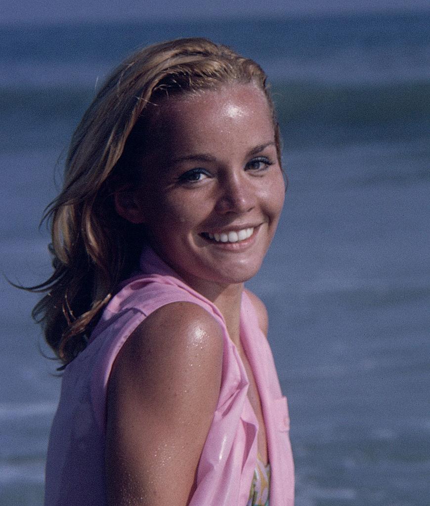 #15 Tuesday Weld as she glaces over her shoulder on a beach, 1963.