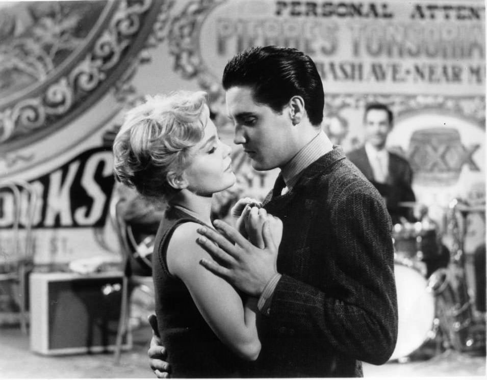 #67 Tuesday Weld and Elvis Presley dance together in a scene from the film ‘Wild In The Country’, 1961.