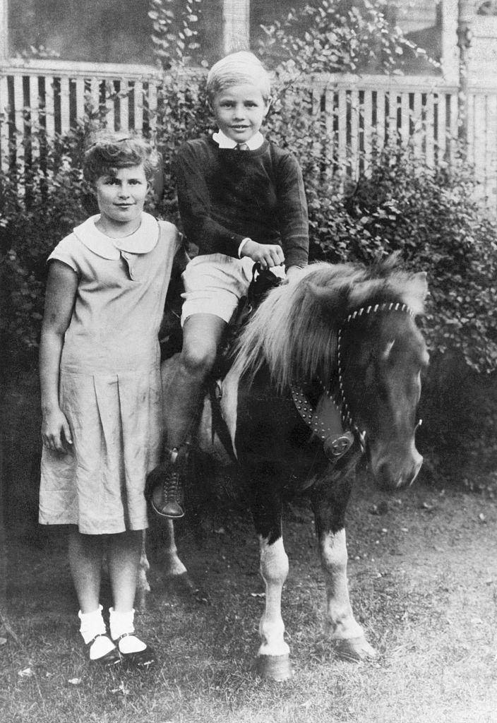 #21 Marlon Brando at age 6 with his sister., 1930.