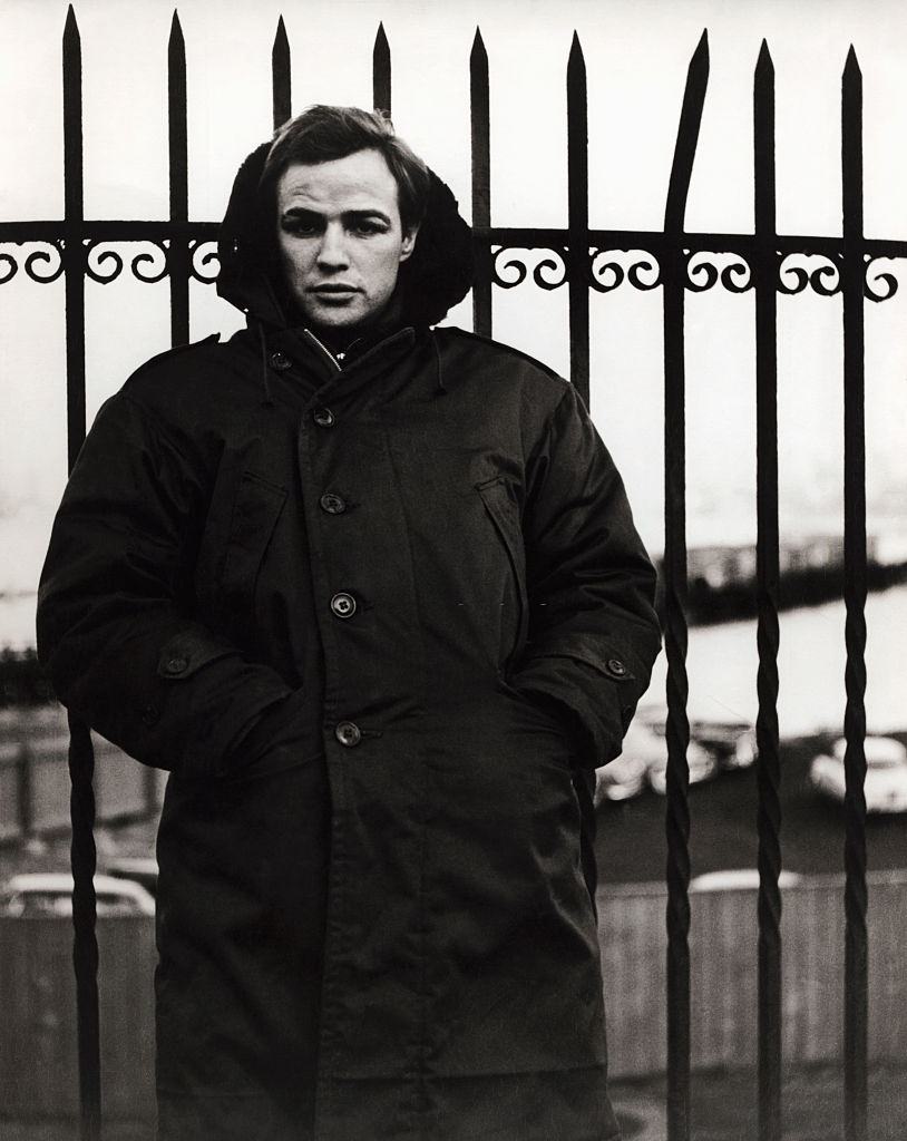 #27 Marlon Brando wears a heavy overcoat in Fort Lee, New Jersey, 1962.