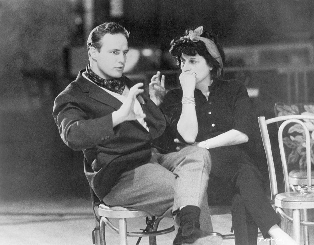 #45 Marlon Brando and Anna Magnani seated and talking, 1950s.