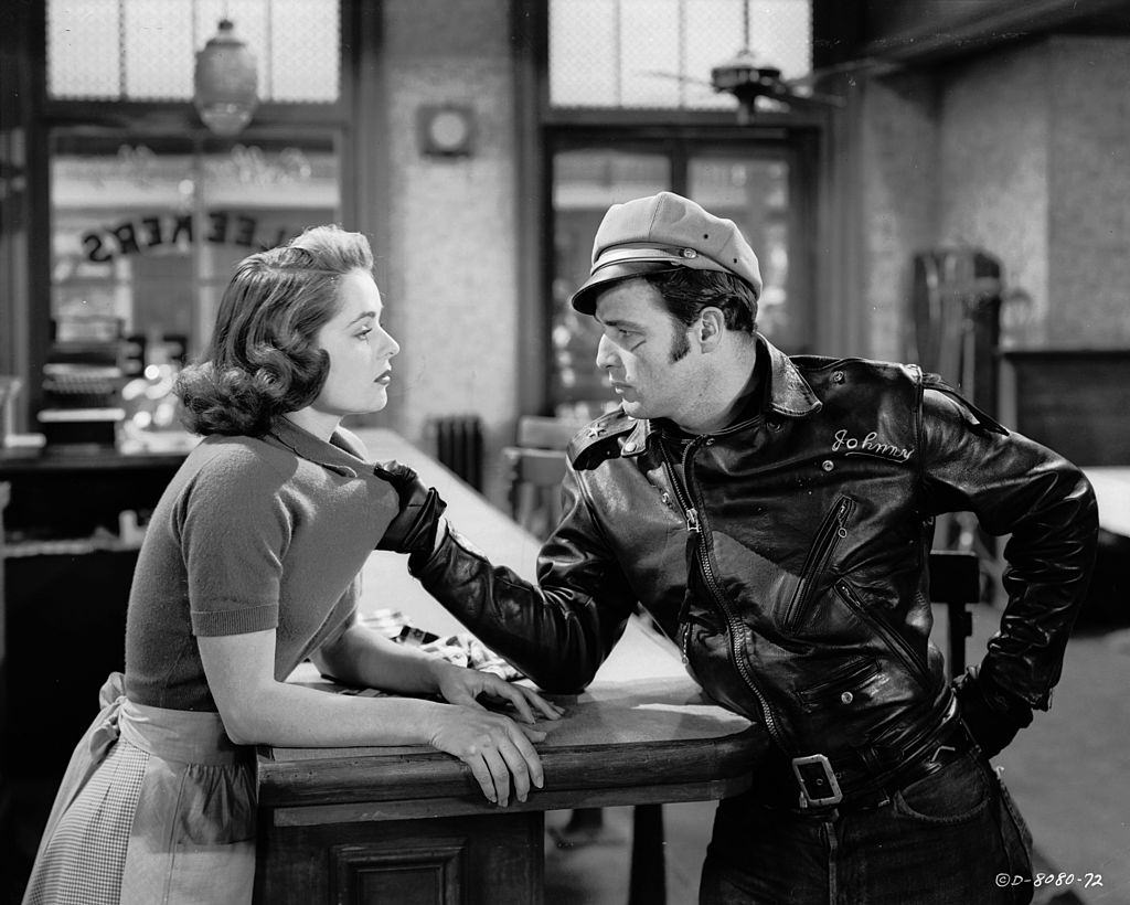 #38 Marlon Brando with Mary Murphy in the movie ‘The Wild One’, 1953.
