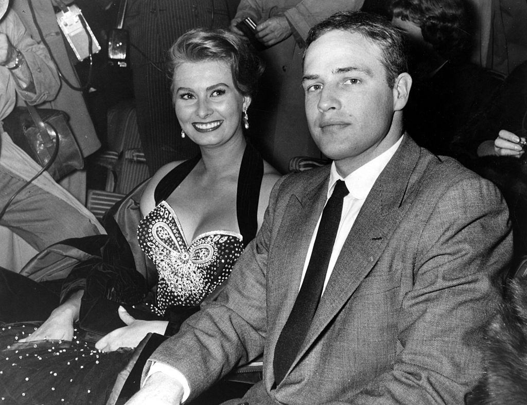 #69 Marlon Brando with Sophia Loren, 1954.