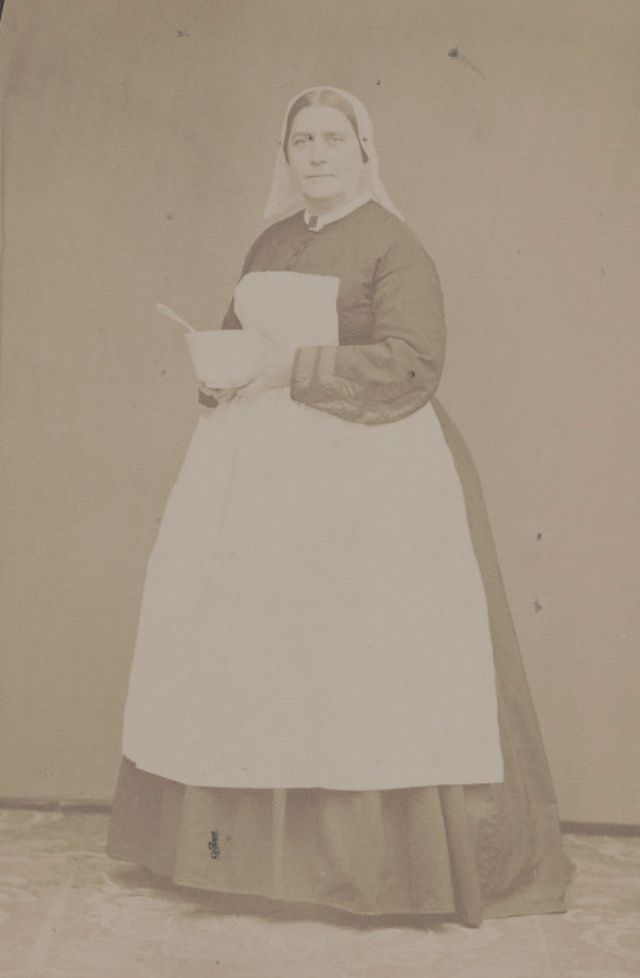 Civil War nurse partially identified as Miss Davis of South Street Hospital, Philadelphia, Pennsylvania, in traditional nurse’s uniform
