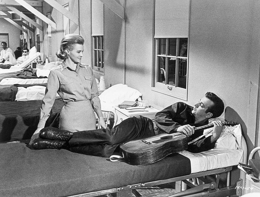 #37 Angie Dickinson introduces herself to a new patient, Bobby Darin. A scene from Universal’s “Captain Newman, M.D.