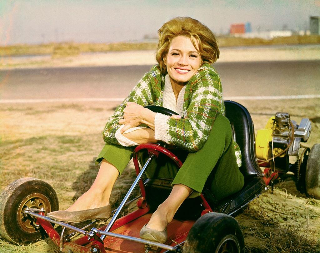 #47 Angie Dickinson sitting in go-cart, 1960.