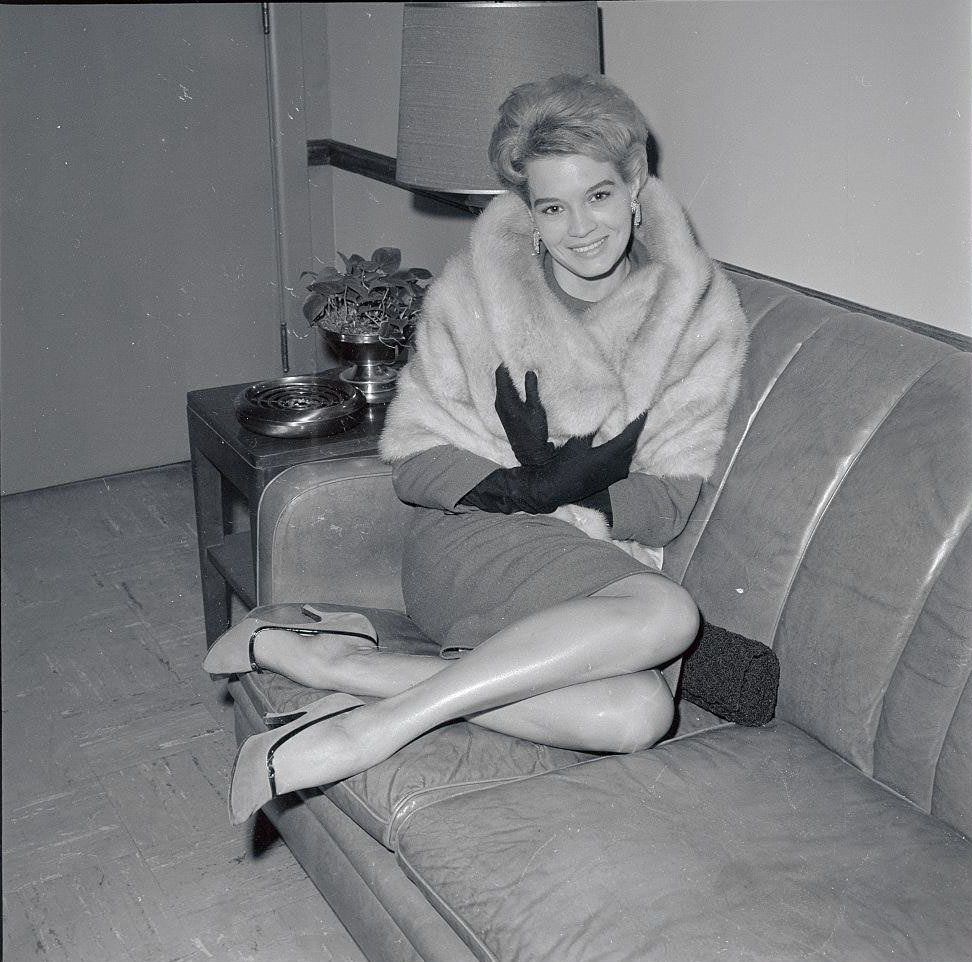 #69 Angie Dickinson at La Guardia airport from Boston to plug her forthcoming film, ‘The Bramble Bush’, 1960.