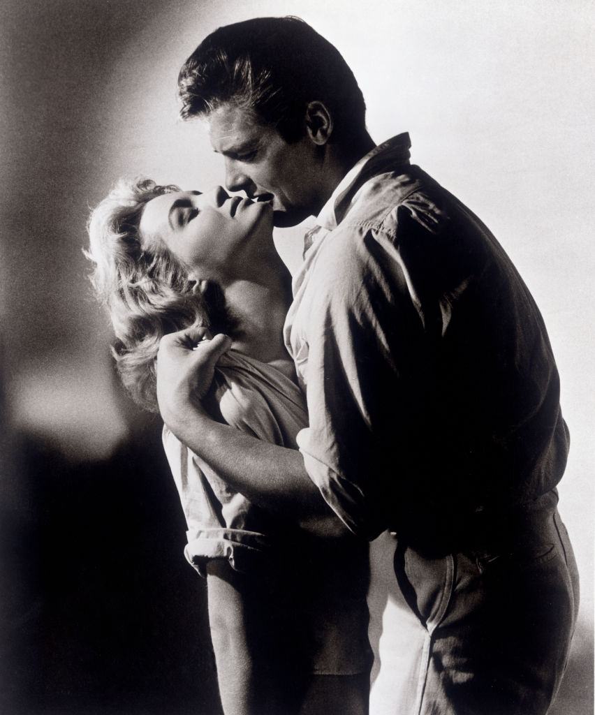 #58 Agine Dickinson with Roger Moore in a love scene in ‘The Sins of Rachel Cade.