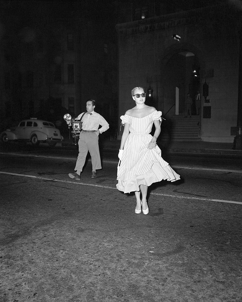 #22 Barbara Payton returning from the hospital and photographers waiting for her, 1951.