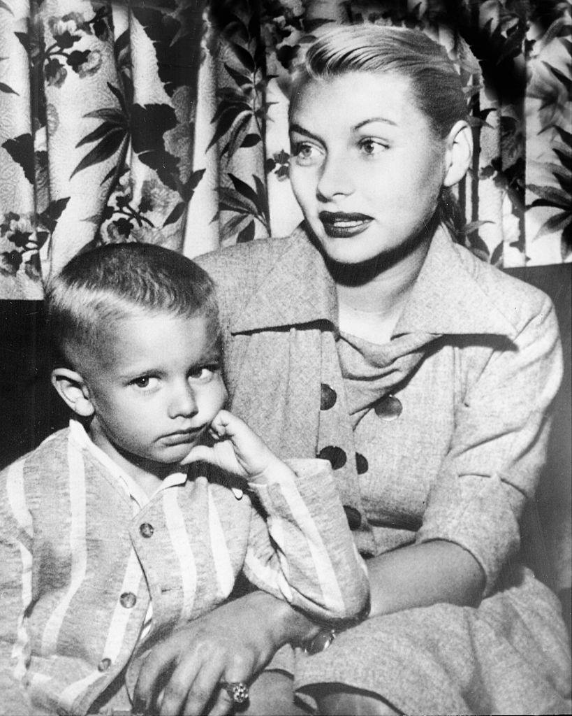 #23 Barbara Payton and her son, Denny, as they arrived in Minneapolis on their way to Cloquet, 1951